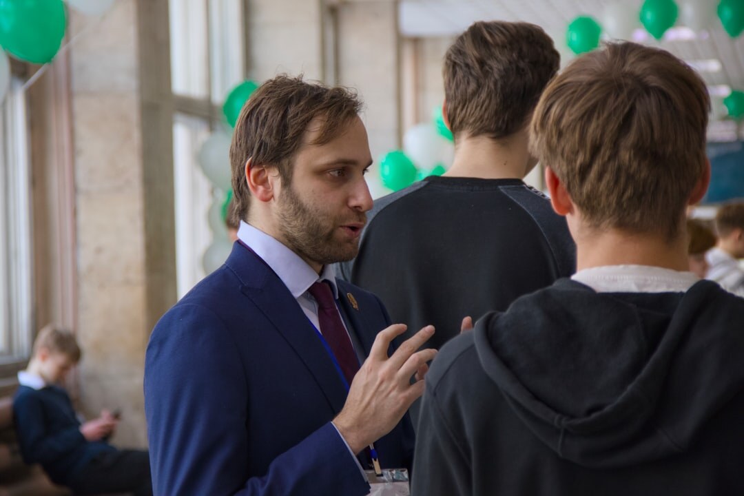 Professionals networking and talking after a business conference
